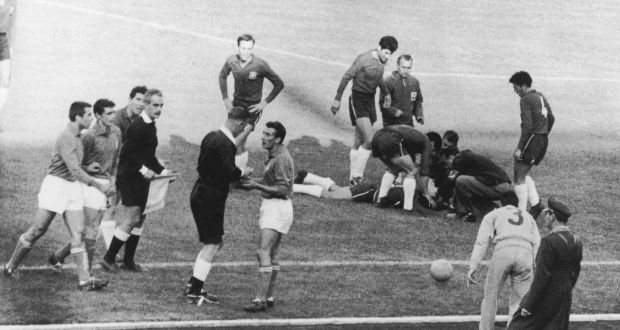 English referee Ken Aston sends off Italian player Mario David, while an injured Chilean lies on the ground, during the match between Italy and Chile in the World Cup, Santiago,June 7th 1962. Photograph: Keystone/Hulton Archive/Getty
