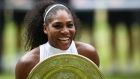  Serena Williams poses with the winner’s trophy at  the 2016 Wimbledon Championships. Photograph:  Glyn Kirk/AFP/Getty Images