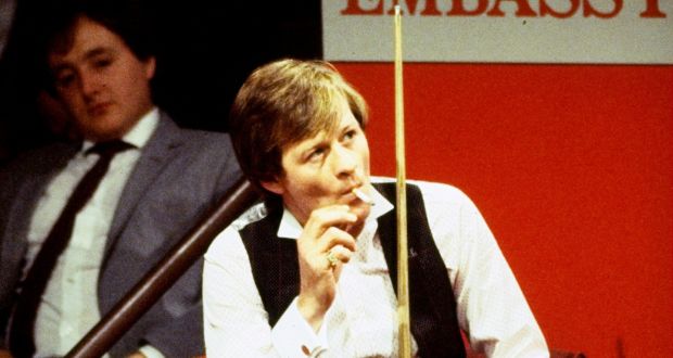 Alex ‘’Hurricane’’ Higgins of Northern Ireland smokes between shots during the 1983 Embassy World Snooker Championships at the Crucible Theatre in Sheffield, England. Photo: Adrian Murrell/Allsport