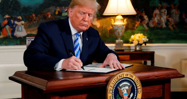 US President Donald Trump signs a proclamation declaring his intention to withdraw from the JCPOA Iran nuclear agreement  at the White House on Tuesday. Photograph: Jonathan Ernst/Reuters 