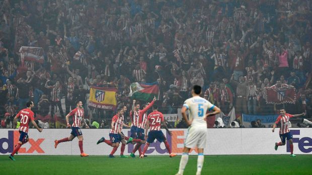 Atlético Madrid celebrate Antoine Griezmann’s second against Marseille. Photograph: Jeff Pachoud/AFP
