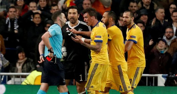 Juventus’ Gianluigi Buffon and team mates remonstrate with referee Michael Oliver after he awarded a penalty to Real Madrid in their Champions League semi-final. Photo: Paul Hanna/Reuters