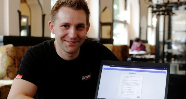 Austrian lawyer and privacy activist Max Schrems displays his Facebook account’s updated terms page.  Photograph: Heinz-Peter Bader/Reuters