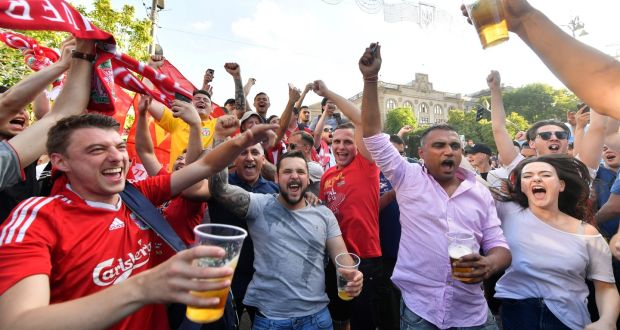 Liverpool  fans cheer in the fan zone in Kiev  on the eve of the  Champions League final against  Real Madrid. Photograph:  Sergei Supinsky/AFP/Getty Images