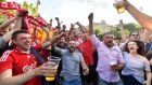 Liverpool  fans cheer in the fan zone in Kiev  on the eve of the  Champions League final against  Real Madrid. Photograph:  Sergei Supinsky/AFP/Getty Images