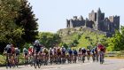 Riders pass the Rock of Cashel during stage  six of the Rás Tailteann, from  Mitchelstown to Carlow yesterday. Photograph: Bryan Keane/Inpho 