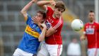 Tipperary’s Bill Maher is challenged by Ian Maguire of Cork during the Munster SFC semi-final at  Semple Stadium. Photograph: Oisín Keniry/Inpho