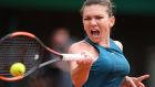 Romania’s Simona Halep returns the ball to Alison Riske  during their women’s singles first-round match at the Franch Open. Photograph: Eric Feferberg/AFP/Getty Images