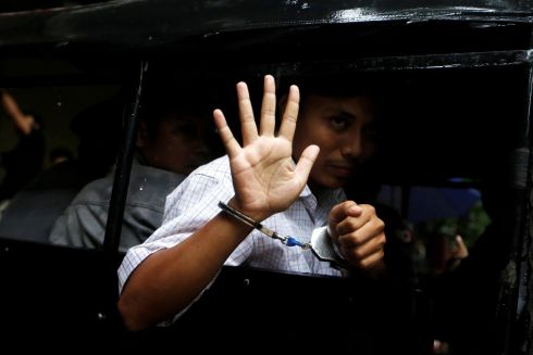 DETAINED JOURNALIST: Detained Reuters journalist Kyaw Soe Oo leaves in a police vehicle after a court hearing in Yangon, Myanmar. Photograph: Ann Wang/Reuters
