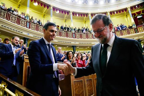 SPANISH HANDOVER: Spain's new prime minister Pedro Sánchez shakes hands with former PM Mariano Rajoy in parliament, in Madrid. Photograph: Pierre-Philippe Marcou - Pool/Getty Images
