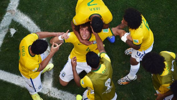 Brazil’s David Luiz celebrates scoring his team’s first goal against Chile in the 2014 World Cup. Photograph: Getty Images