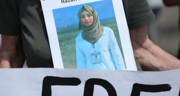  Razan al-Najar, the Palestinian nurse reportedly killed by Israeli soldiers recently, in an image worn at a demonstration in Berlin  prior to the arrival of Israeli prime minister Binyamin Netanyahu. Photograph: Sean Gallup/Getty 