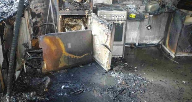 Fire damage to a fridge-freezer inside the kitchen of flat 16 of Grenfell Tower, which was the source of last year’s blaze in which 71 people died.  Photograph:   Grenfell Tower Inquiry/AFP/Getty Images
