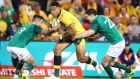 Australia’s Israel Folau   is tackled by Conor Murray and Johnny Sexton in his side’s 18-9 Test victory on Sunday. Photograph:   Mark Kolbe/Getty Images