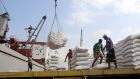 Workers unload wheat provided by Unicef at Hodeidah: the Red Sea port  is a key entry point for aid to war-torn Yemen. Photograph: Abdo Hyder/AFP/Getty 