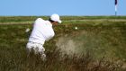   Rory McIlroy plays a shot from a bunker on the 11th hole during the first round of the US Open at Shinnecock Hills. Photograph: Rob Carr/Getty Images