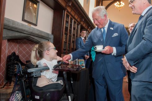 The Prince of Wales in Aula Maxima, UCC, meeting activist and student Joanne O'Riordan. They are joined by Prof John O'Halloran. Photograph: Daragh McSweeney/Provision
