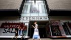 Shoppers walk past a Debenhams shop in Oxford Street,  London.  The group’s poor performance has been blamed on increased discounting by rival high street retailers. Photograph: Tolga Akmen/AFP/Getty 