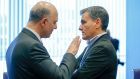 European commissioner for economic and financial affairs Pierre Moscovici and Greek finance minister Euclid Tsakalotos:  EU officials are convinced the Greek government under Alexis Tsipras remains committed to  stiff fiscal targets. Photograph: Julien Warnand