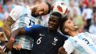  France’s midfielder Paul Pogba heads the ball with Argentina defenders Nicolas Otamendi  and  Nicolas Tagliafico during the  World Cup round of 16 match at the Kazan Arena. Photograph: Franck Fife/AFP/Getty Images