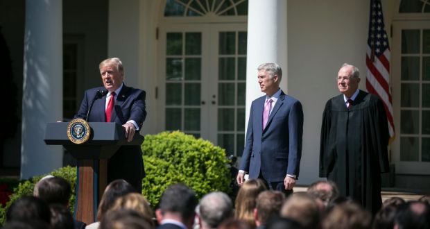 US president Donald Trump with supreme court judges Neil Gorsuch and Anthony Kennedy at the Rose Garden of the White House in Washington last year. File photograph: Al Drago/The New York Times