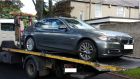 A file photograph of a stolen BMW being recovered by gardaí. Many criminals involved in organised crime are now opting to drive less ostentatious vehicles.  Photograph: Garda Síochána
