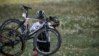   Chris Froome carries his bicycle after falling into a ditch during the first stage. Photograph: Jeff Pachoud/Reuters