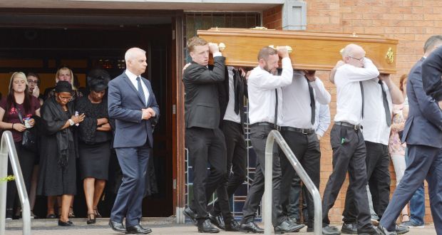 The remains of Joe O’Callaghan, Douglas are taken from the Church of the Incarnation in Cork, following requiem mass with his widow Angeline being comforted as she walks behind. Photograph: Provision