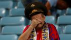 A dejected Russia fan at the end of the  World Cup quarter-final against Croatia in Sochi. Photograph: Carl Recine/Reuters