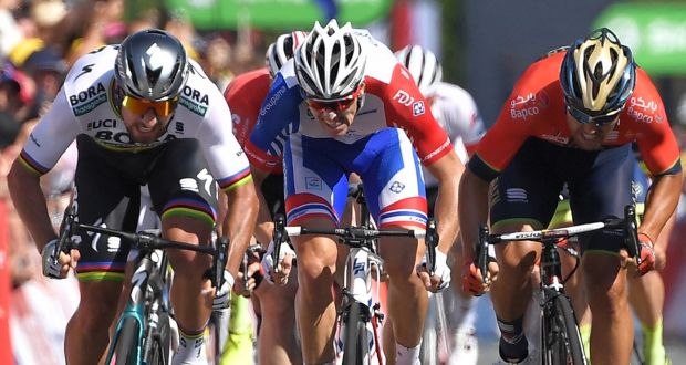 Peter Sagan (left)  wins the sprint  ahead of Italy’s Sonny Colbrelli (right) and France’s Arnaud Demare (centre) in the  second stage  of the Tour de France  between Mouilleron-Saint-Germain and La Roche-sur-Yon. Photograph:  Marco Bertorello/AFP/Getty Images