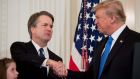 Brett Kavanaugh is congratulated by Donald Trump after the US president nominated him as a justice of the supreme court. Photograph: Saul Loeb/AFP/Getty Images