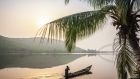 Local paddling in wooden canoe, Volta River, Ghana. Photograph: Getty images