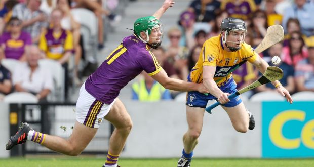Clare’s Tony Kelly is challenged by Aidan Nolan of Wexford. Photograph: Tommy Dickson/Inpho