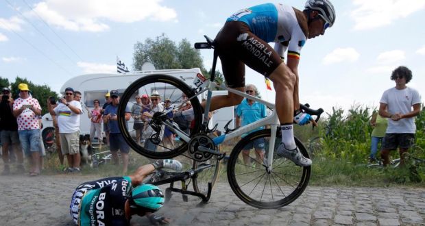  AG2R La Mondiale rider Olivier Naesen goes over the  top of Bora Hansgrohe rider Rafal Majka during the ninth stage of the Tour de France cycling between Arras and Roubaix. Photograph: Kim Ludbrook/EPA