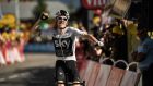 Britain’s Geraint Thomas celebrates as he crosses the finish line to win the 11th stage of the 105th edition of the Tour de France cycling race between Albertville and La Rosiere. Photo: Marco Bertorello/Getty Images