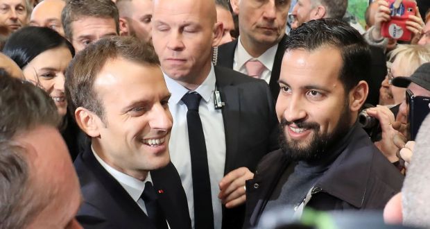 French president Emmanuel Macron flanked by Élysée former senior security officer Alexandre Benalla. Photograph: Ludovic Marin/Pool via Reuters