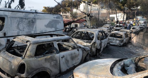 Destroyed  cars  after fire swept through the Mati area, 30km east of Athens. killed at least 88 people. Photograph: EPA/Pantelis Saitas