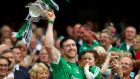 Limerick’s Séamus Hickey, with his daughter Anna, holds aloft the Liam MacCarthy cup following Limerick’s All-Ireland SHC final win at  Croke Park on Sunday. Photograph: James Crombie/Inpho