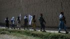 File photograph taken in June shows Afghan Taliban militants walking to celebrate an earlier ceasefire on the second day of Eid in the outskirts of Jalalabad. Photograph: Getty Images