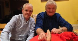 Vincent O’Brien and Noel McDonagh of Waterford History Group with a flint axe.