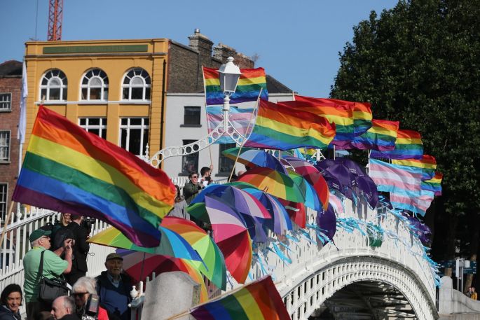 LGBT protesters with flags and umbrellas on the Ha'Penny Bridge, Dublin, to remember the victims of clerical sex abuse ahead of the start of Pope Francis's visit. Photograph: Niall Carson/PA Wire
