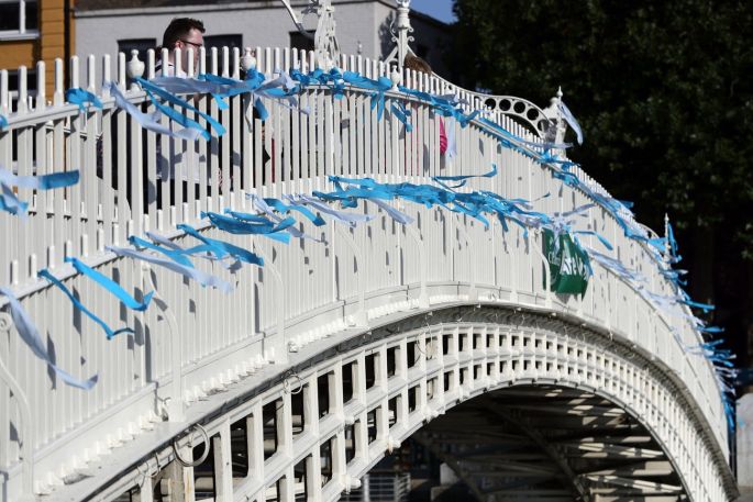 Blue ribbons are tied to the Ha'Penny Bridge, Dublin, to remember the victims of clerical sex abuse ahead of the start of the visit to Ireland by Pope Francis. Photograph: Aaron Chown/PA Wire
