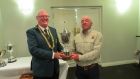 Séamus O’Loughlin (Ennis), winner of ITFFA individual competition on Lough Lene, receiving the Lennon Cup from president, John Deacy