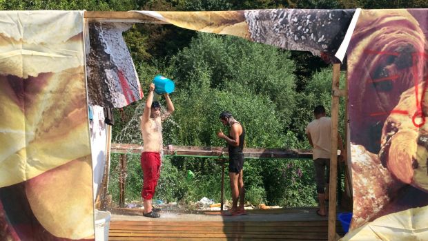 Makeshift washing facilities at a camp in Velika Kladusa, near Bosnia’s border with Croatia, now home to hundreds of migrants. Photograph: Daniel McLaughlin
