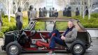Inventor and entrepreneur Sir James Dyson at his Malmesbury offices in  Wiltshire, England,  with a bisection of an original Mini. Dyson has unveiled expansion plans to  more than double capacity at the facility for electric-vehicle testing. Photograph:  Adrian Sherratt 