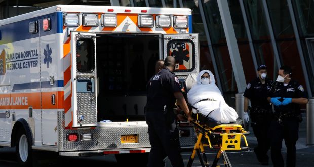  A passenger from Emirates Flight 203 from Dubai that landed at JFK International Airport is transported on a stretcher by paramedics to an ambulance  in JFK International Airport in Queens, New York. Photograph: Peter Foley/EPA 