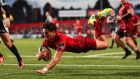 Munster’s Joey Carbery scores a try during the Guinness Pro 14 match against Ospreys in Cork. Photograph: Billy Stickland/Inpho