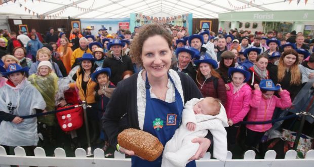 Emma Ferguson from Trim, Co Meath, with her two-week-old son Paddy  after winning the National Brown Bread Baking Competition at the National Ploughing Championships. Photograph: Leon Farrell Photocall Ireland