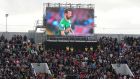 A tribute screen displaying photographs of Liam Miller above the stands during the tribute match at Páirc Uí Chaoimh, Cork. Photograph: Niall Carson/PA Wire