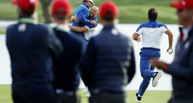 Alex Noren of Europe celebrates with Thorbjorn Olesen after winning his match on the 18th green as Europe win the Ryder Cup  at Le Golf National in Paris, France. Photo: Jamie Squire/Getty Images